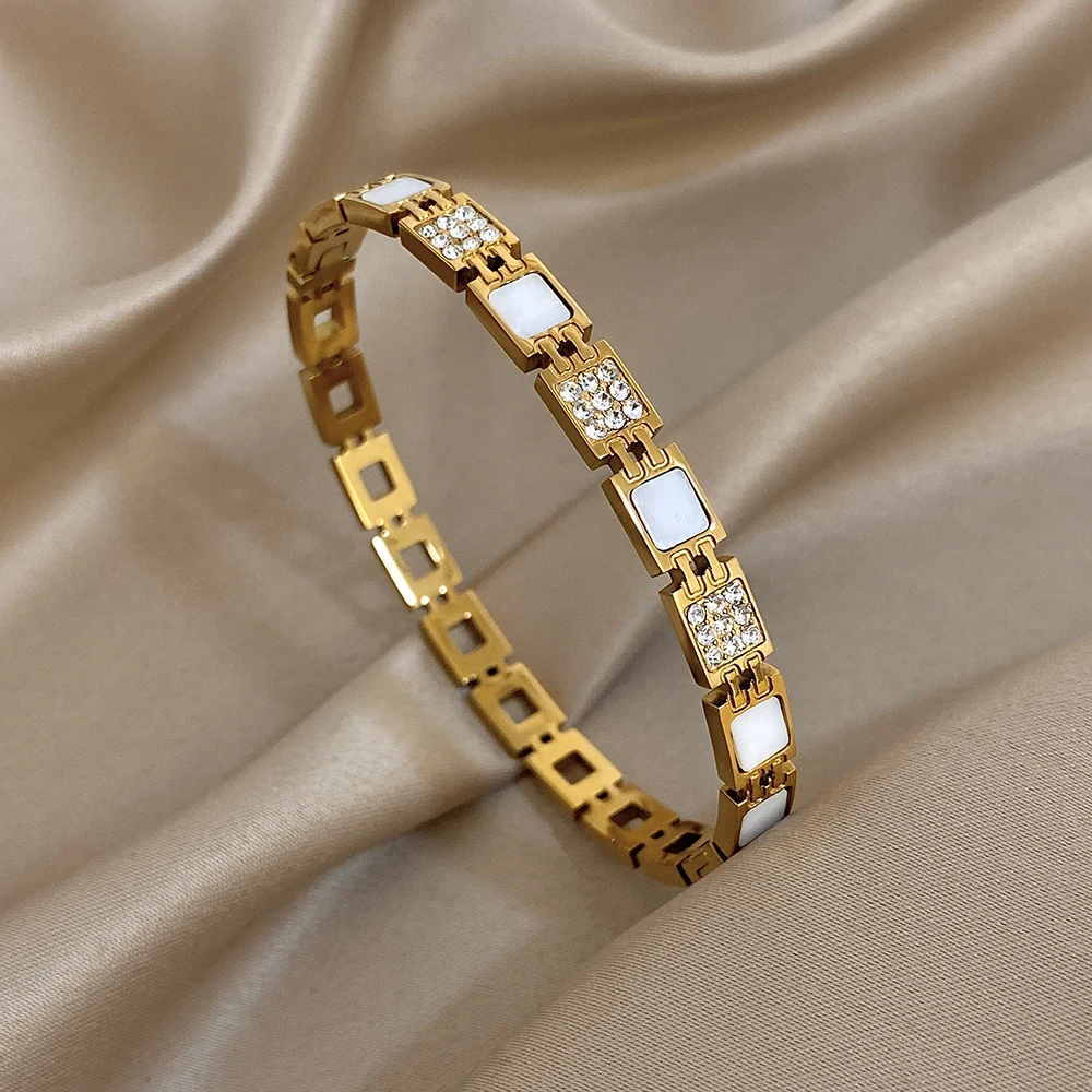 Freetry أنيقة الزركون الفولاذ المقاوم للصدأ الكفة سوار المرأة بسيطة هندسية الملتوية مطلية بالذهب الربيع الإسورة مجوهرات مقاومة للماء