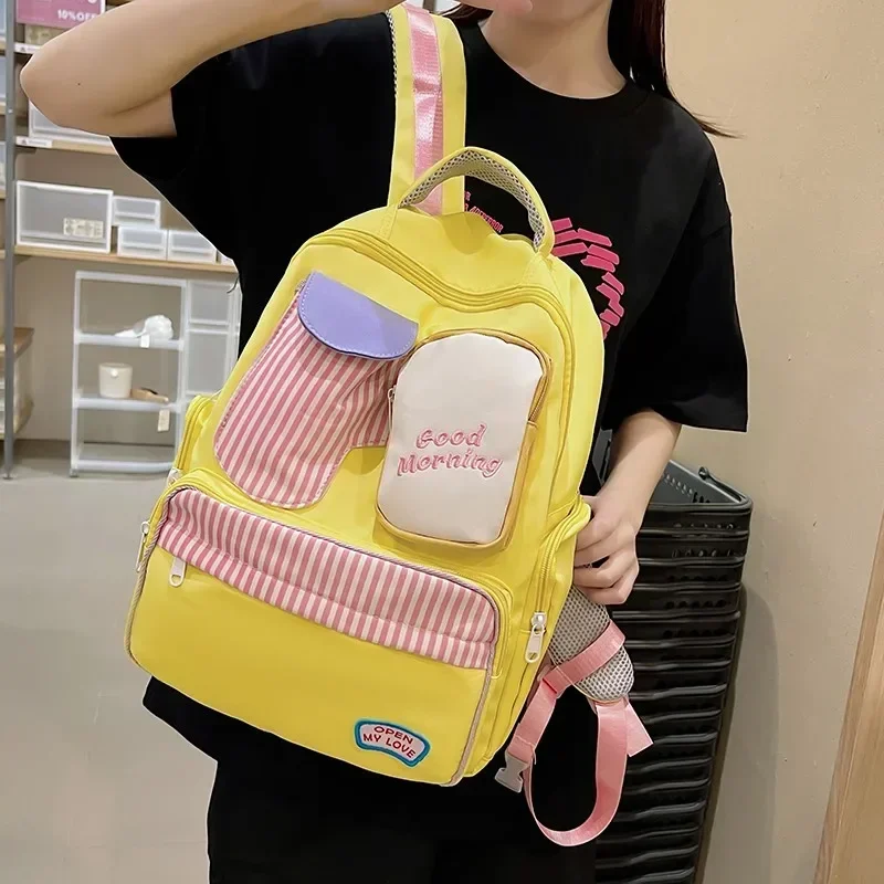 Female Bags on Sale 2024 High Quality Fashionable and Large Capacity Backpack Canvas Letter Patchwork Zipper Backpacks 여성용 가방