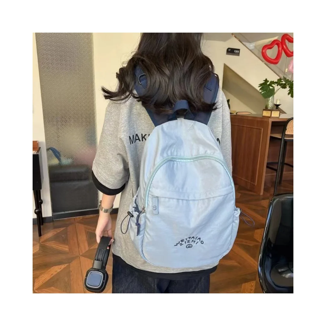 Embroidery smiling face haze blue backpack Korean female large capacity student bag outdoor travel light hiking backpack