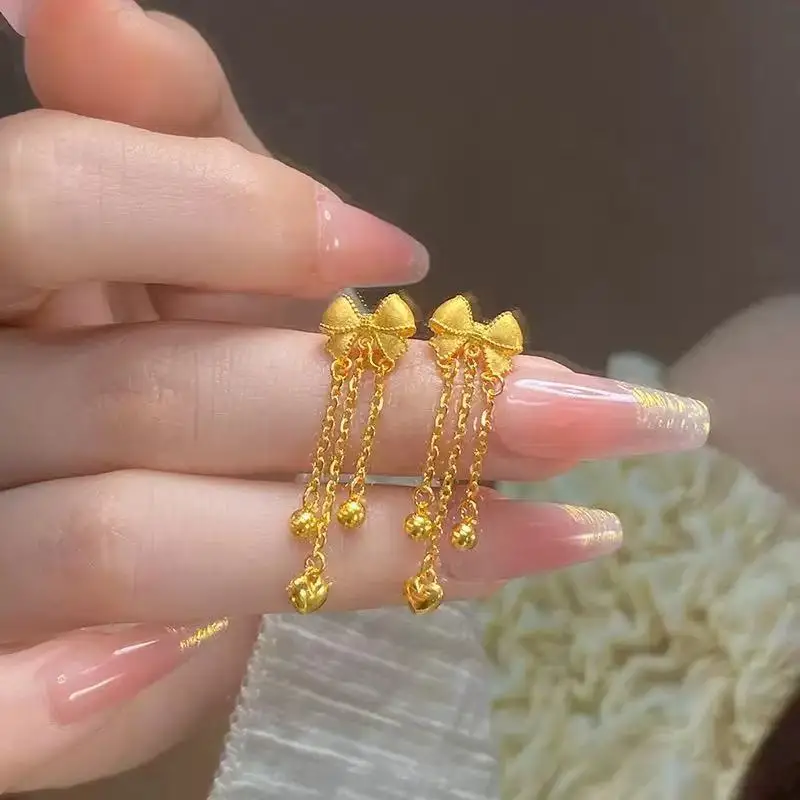New Chinese style bow tassel earrings female retro sweet all build light luxury temperament senior sense 9999gold