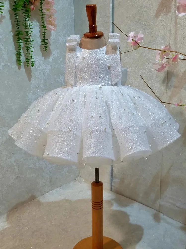 Jill Wish M049 White Glitter Baby Dress with Pearl Embellishments & Bow Shoulder Straps – Giant Back Bow Birthday Pageants