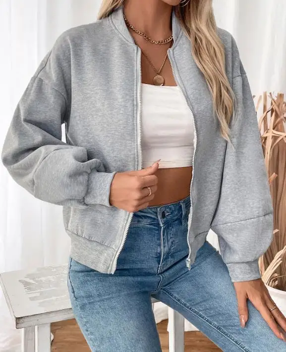 ゆったりとした女性の春の無地ラウンドネックジッパーフロントランタンスリーブベースボールジャケットは、スポーツや運動に適しています。