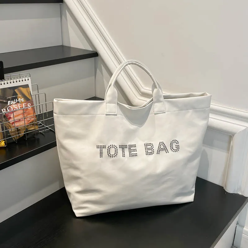 2026 Early Spring New Large Capacity Retro PU Handbags Solid Simple Fashion Versatile Super Cool Rivets Tote Bags for Women