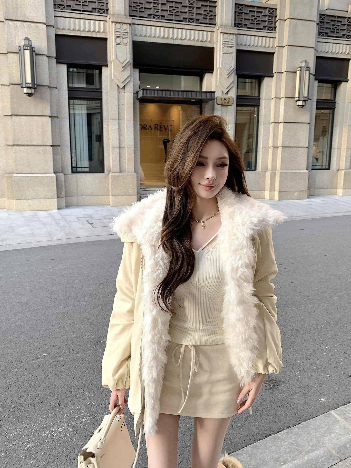 

Warmth And Style: Winter Outerwear with Lamb Fur Collar Integrated Leather And Cotton Loose Fit Zipper Closure Long Sleeve Coat