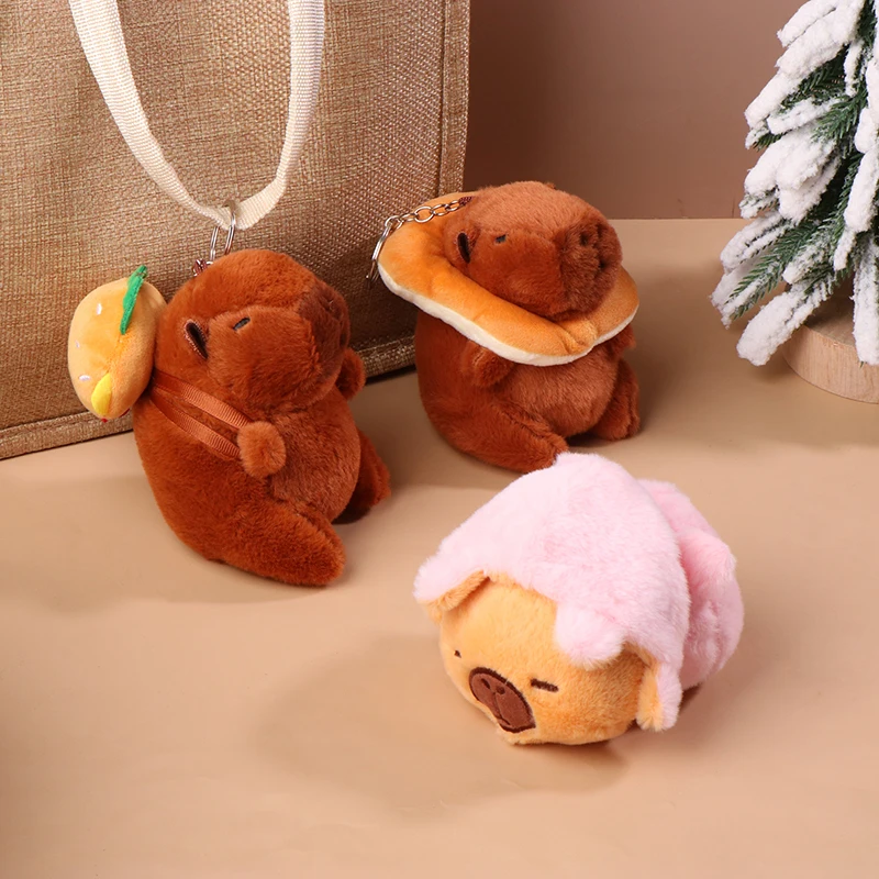 Creative Flip Capybara จี้ตุ๊กตาพวงกุญแจตุ๊กตาการ์ตูน Capybara ตุ๊กตาสัตว์พวงกุญแจตุ๊กตาของเล่นกระเป๋าเป้สะพายหลังแขวนตกแต่ง