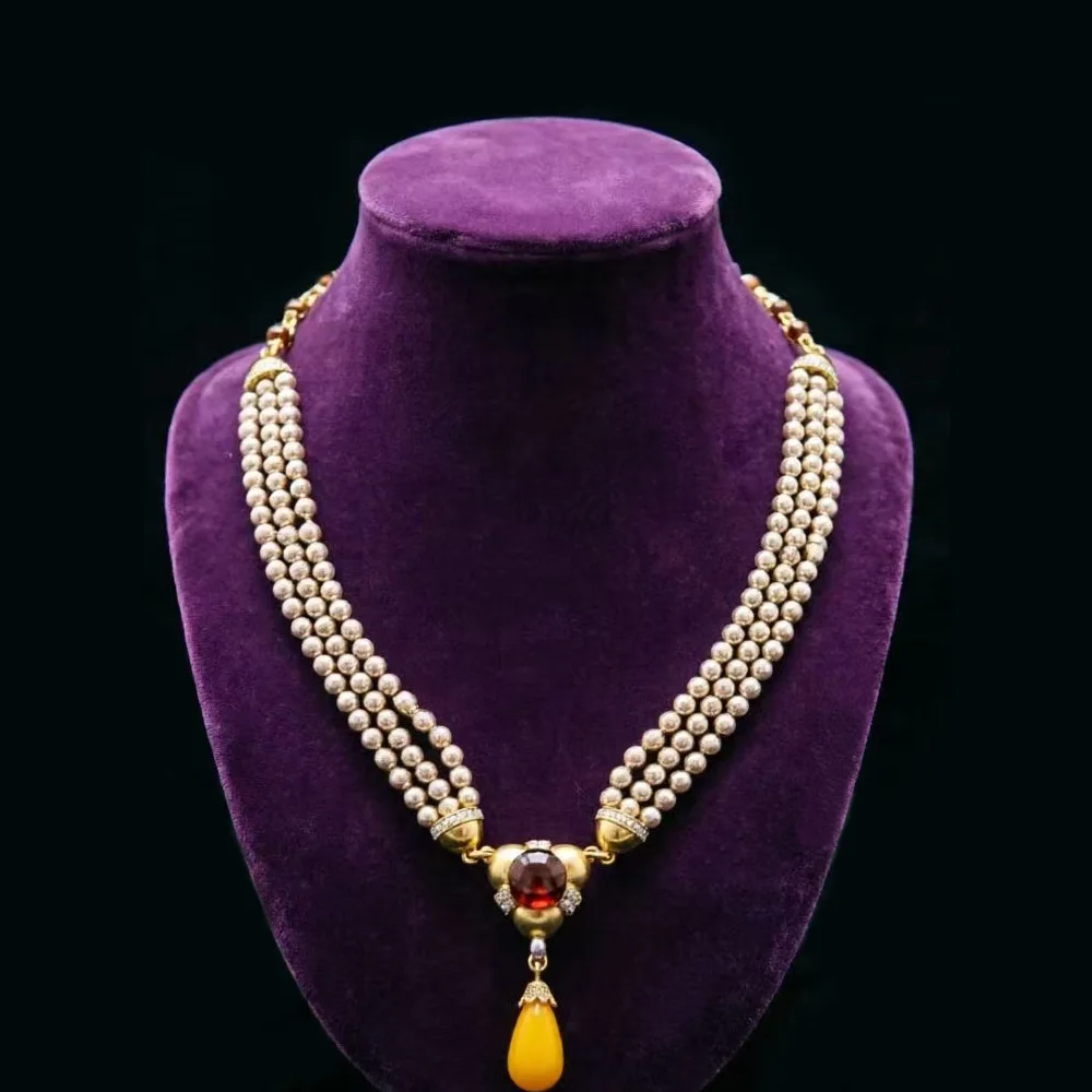 

Vintage jewelry featuring a fashionable and classic white geometric necklace design paired with Bohemian style women's necklace