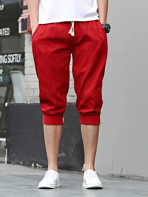 Pantaloni da sette piedi in puro colore giovanile da uomo con risvolto allentato Harem estivo sottile sportivo casual cintura elastica ampia