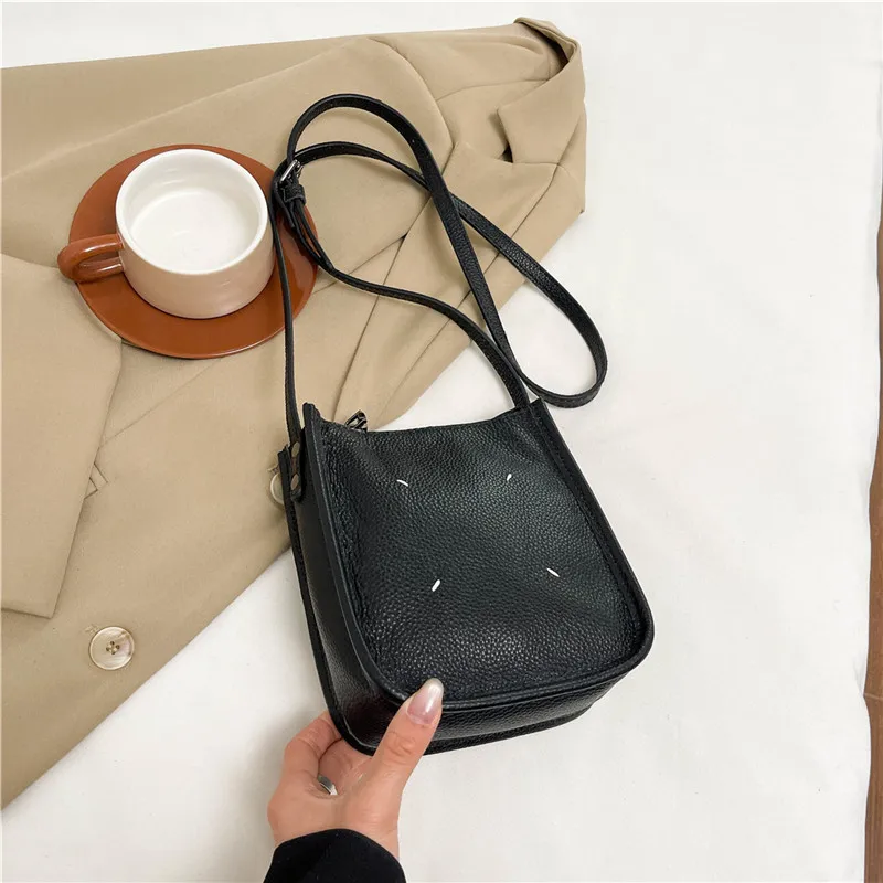 

‌First Layer Cowhide Saddle Bag 2025 - Women's Mini Messenger Purse with Phone Pocket, Niche Spring Shoulder Bag‌