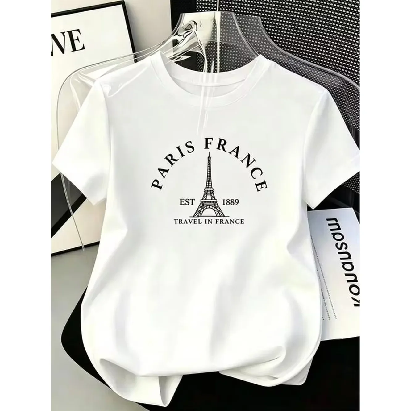 Paris Eiffel Tower graphic T-shirt, minimalist city print T-shirt, French travel style casual short-sleeved top, white summer style for everyday wear.