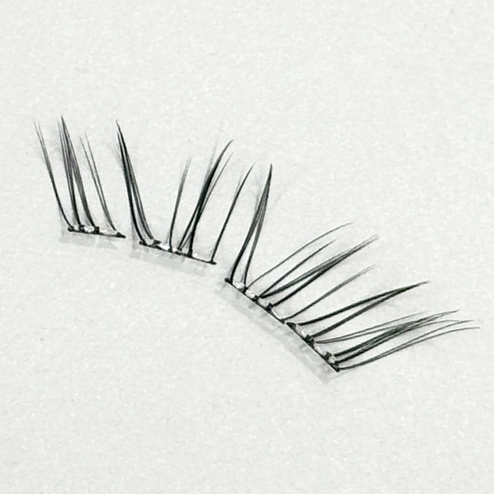 Nuevo estilo chino pestañas postizas sin pegamento Natural fino suave transparente tallo Hada pestañas postizas extensión de pestañas segmentadas