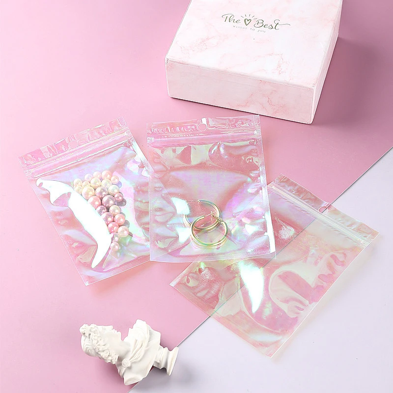 100Pcs Reusable Laser Iridescent Zip Lock Bags	Pink Clear Plastic Packaging Pouches JewelryRetail Bag Cosmetic Holographic Bag