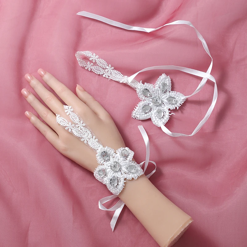 The bride's accessory is a pair of white ring style gloves suitable for women's wedding parties