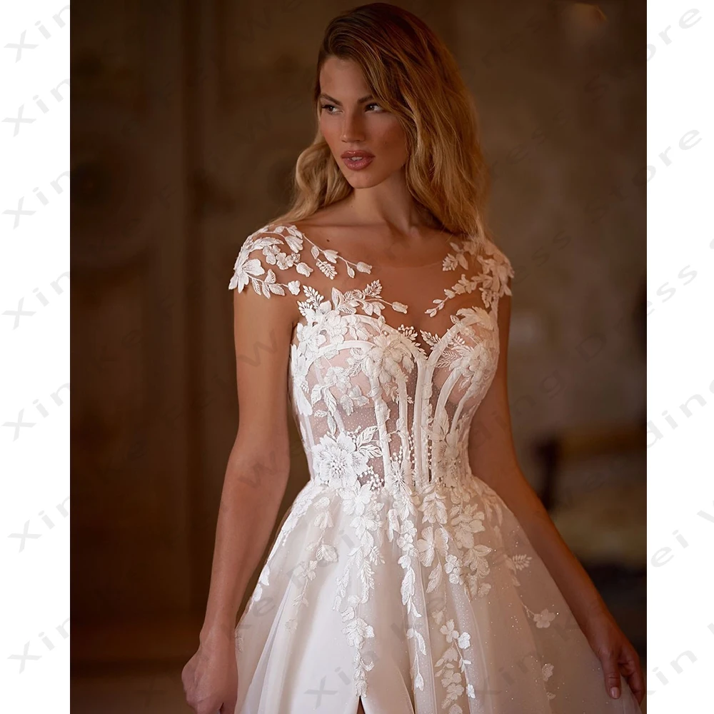 Vestidos de novia elegantes de princesa con apliques de encaje de corte en A y cuello redondo bohemio para mujer con diseño de botón trasero personalizado 2025islavساتmavera