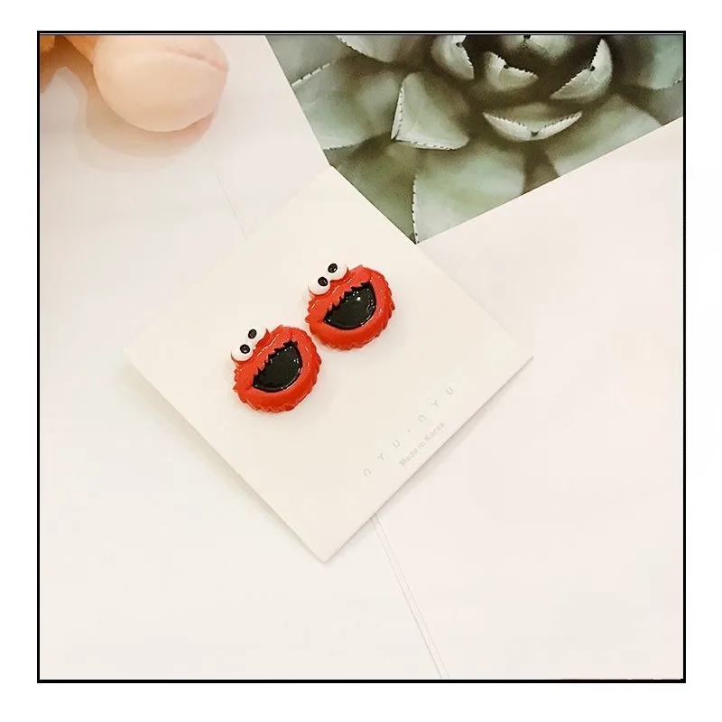 Barrio Sésamo Elmo Cookie Monster anime periférico muñeca de dibujos animados estilo pendientes para niños y niñas accesorios de alto valor regalos