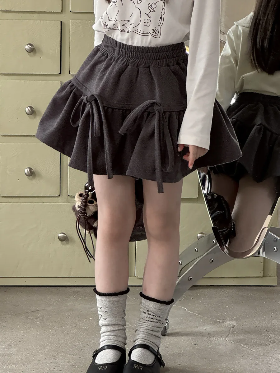 الفتيات الخريف والشتاء النسخة الكورية الجديدة من مرحة القوس حزام تنورة صوفية كلمة تنورة قصيرة أزياء عارضة