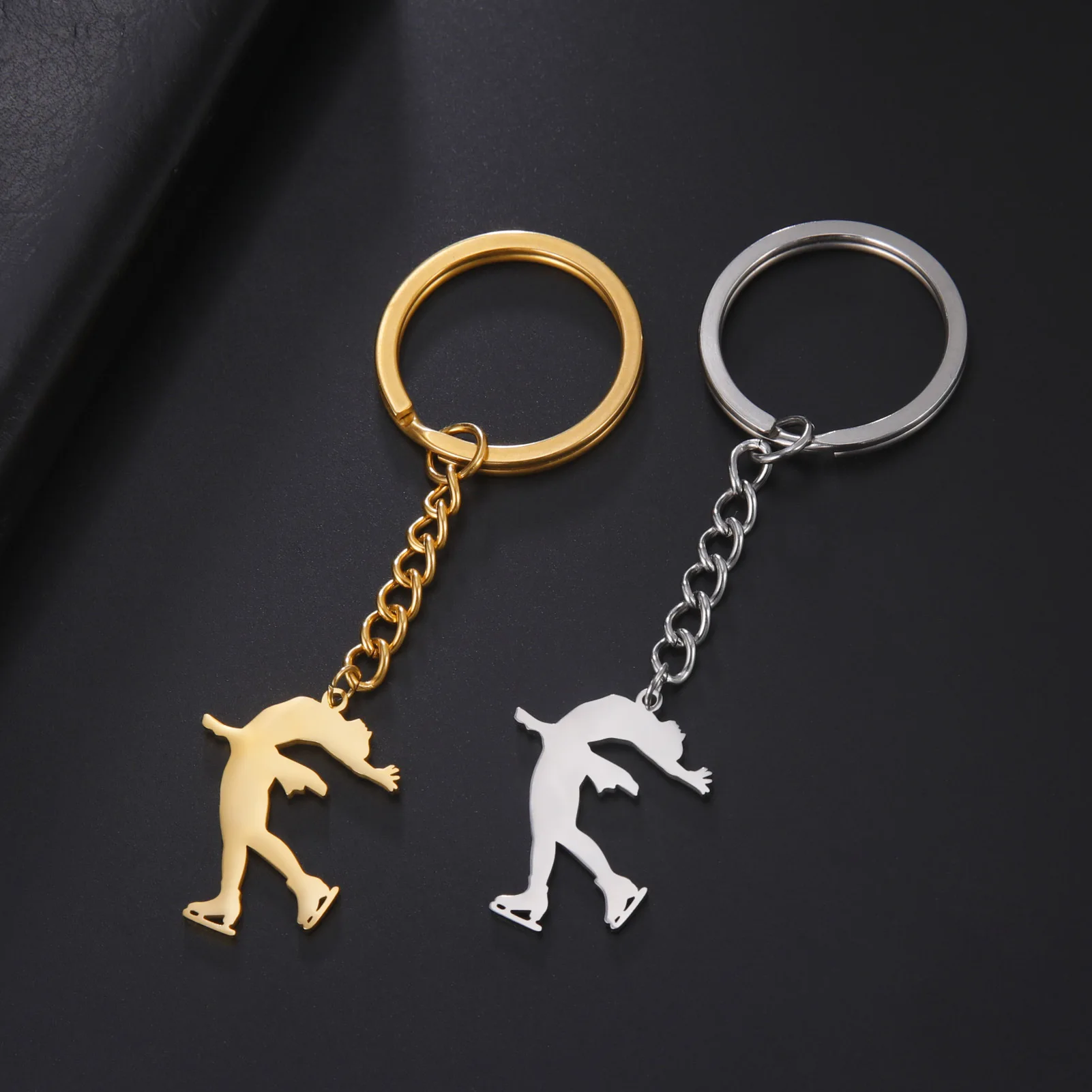 New fashion cut titanium steel chain key chain Figure skating style Smooth pendant sports commemorative stainless steel key chai