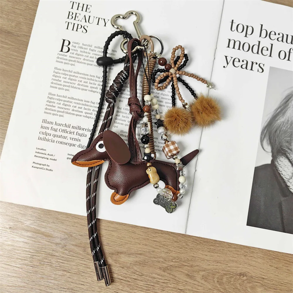 Handmade baseball personality keychain Creative simple soda bread fringe trend accessories Dachshund dog bow hairball bag pendan