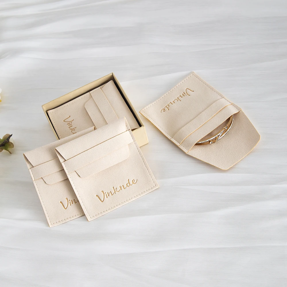 

Акция, роскошный 8*8 см кремовый контейнер для ювелирных изделий из микрофибры, индивидуальный логотип, кольцо, серьги, чехол для подвесок, ожерелье, органайзер для путешествий