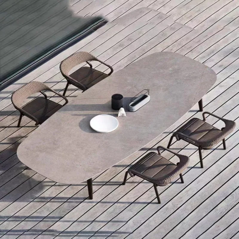 

Outdoor courtyard table and chair villa garden high-end outdoor leisure balcony rattan chair rock slab dining table terrace