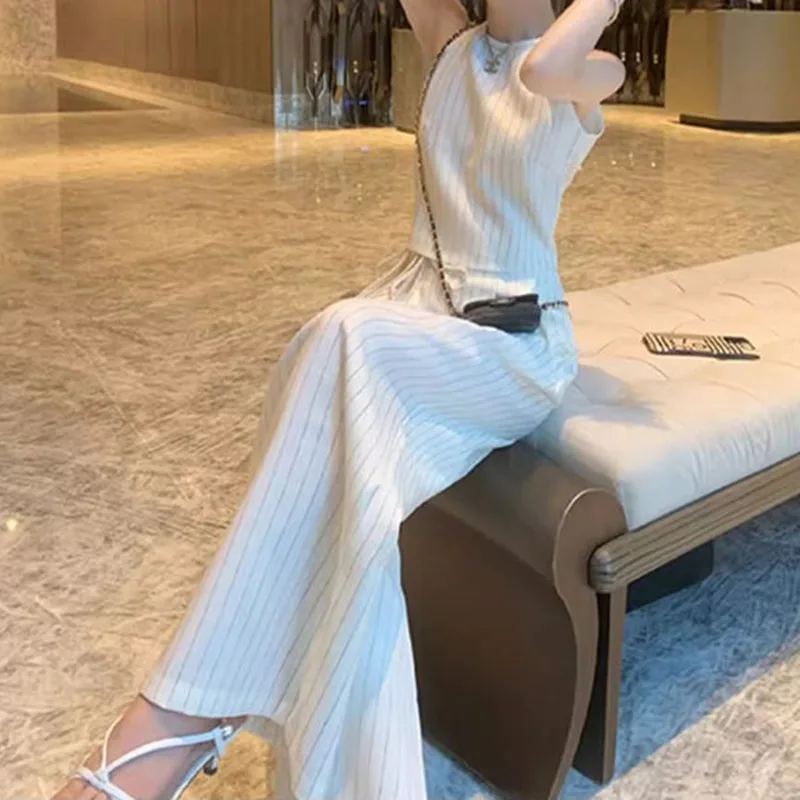 Small fragrance suit female 2024 summer new high sense niche temperament striped vest wide-leg pants two-piece.