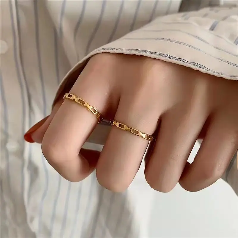 

Golden geometric hollow out titanium steel ring women's senior light luxury niche design is simple and does not fade