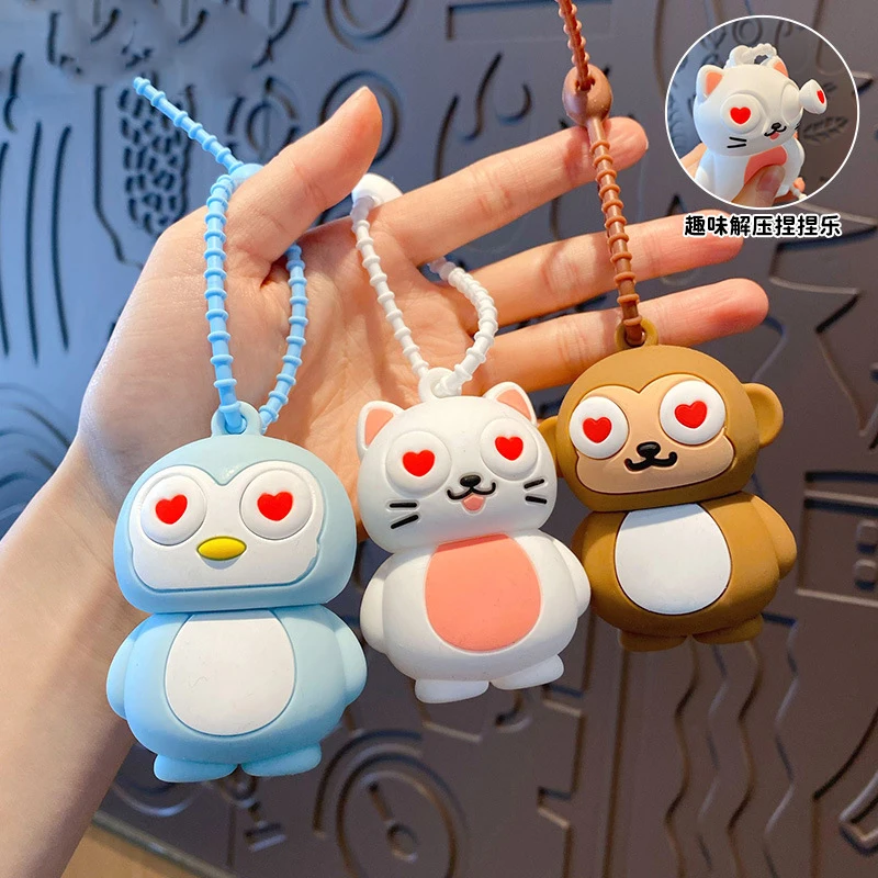 Preciosas mascotas llenas de ojos de amor gato pingüino llavero de Animal lindo pellizco Pop-up amor corazón ojo juguete muñeca llavero bolsas para mujer coche