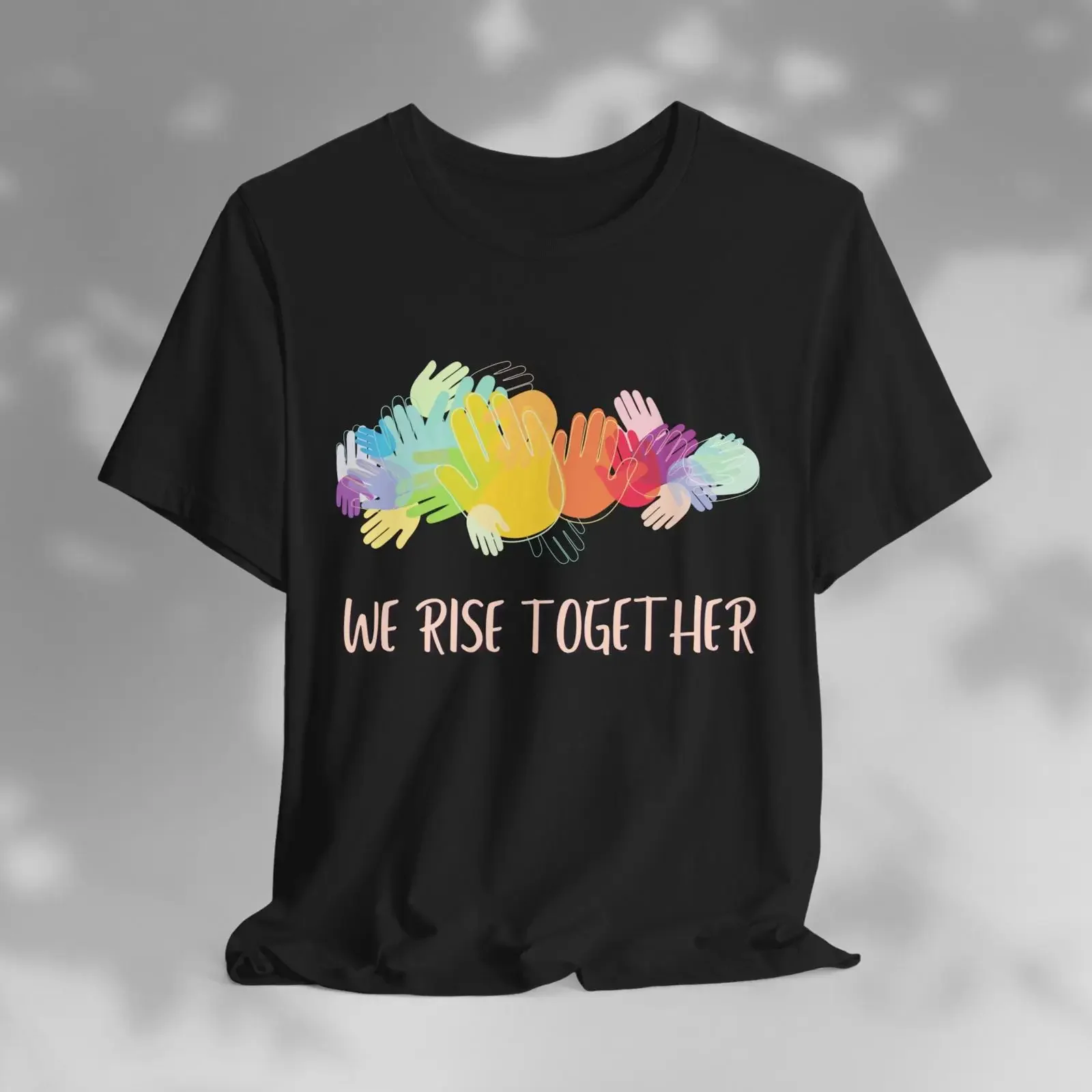 T-shirt We Rise Together avec mains colorées, symbole d'unité, de solidarité et de fierté inclusive, vêtement inspirant, style vintage délavé, unisexe