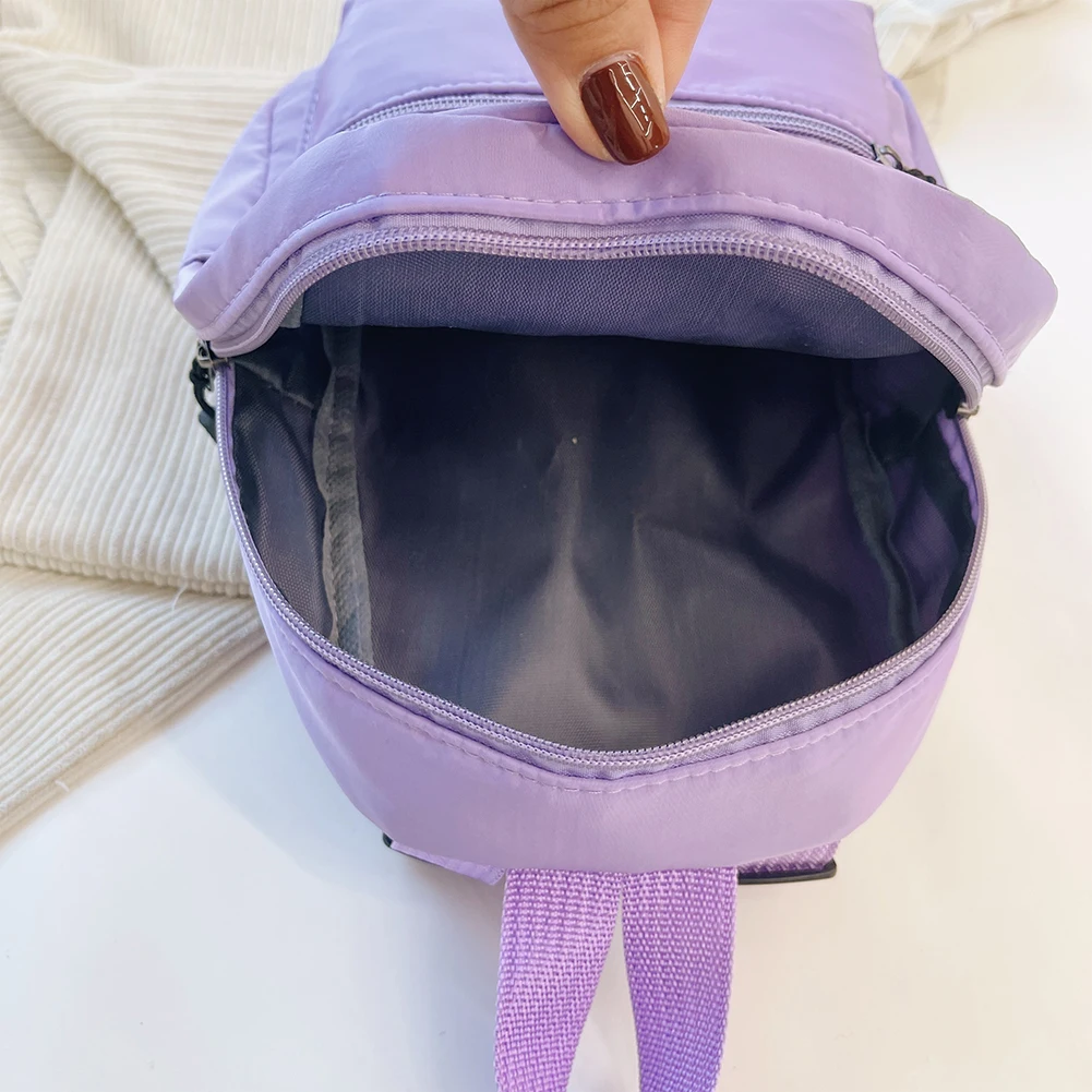 أزياء المرأة لون نقي حقيبة الظهر الإناث نمط Preppy عارضة حقيبة نايلون صغيرة