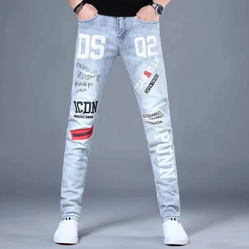 Moda Koreańskie Dżinsy Męskie Graffiti Nadrukowane Litery Spodnie Dżinsowe Męskie Streetwear Slim Fit Niebieskie Dżinsy Hip hop Małe Spodnie Stóp