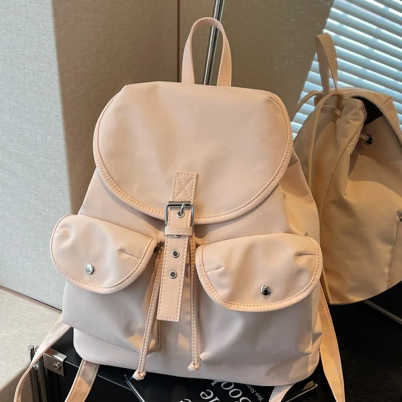 2026 New Women's Nylon Backpack Fashion Flap Drawstring Double Pocket Casual Commute Travel School Bag Light Blue