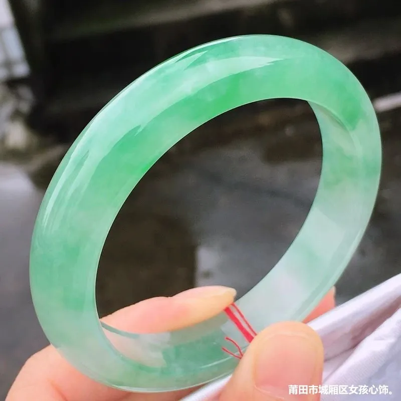 Natural Burmese jade bracelet women's style with a vibrant color ice-like texture and a unique "floating green" patter