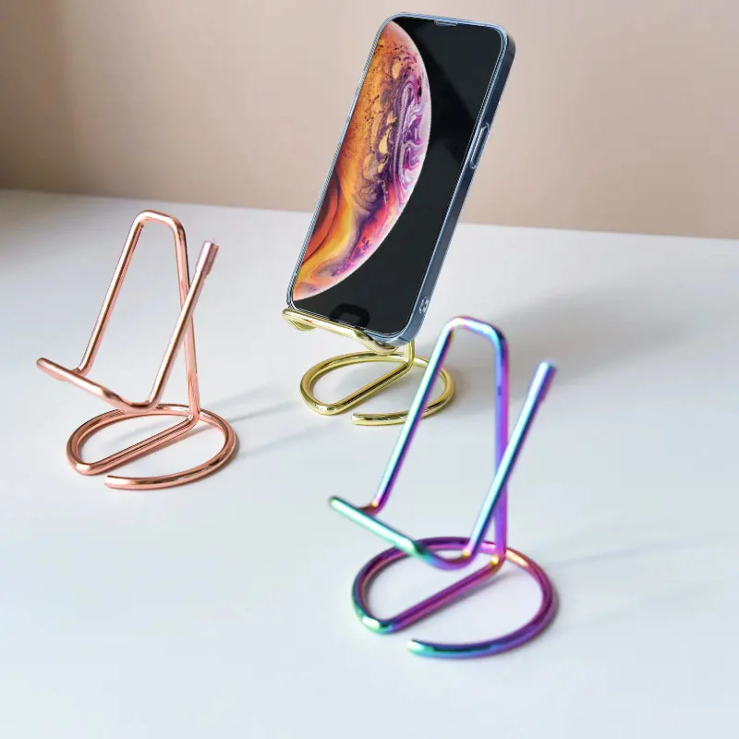 

Functional and modern desktop tablet and phone holder with an elegant gold-plated metal iron craft design. Keep your devices org