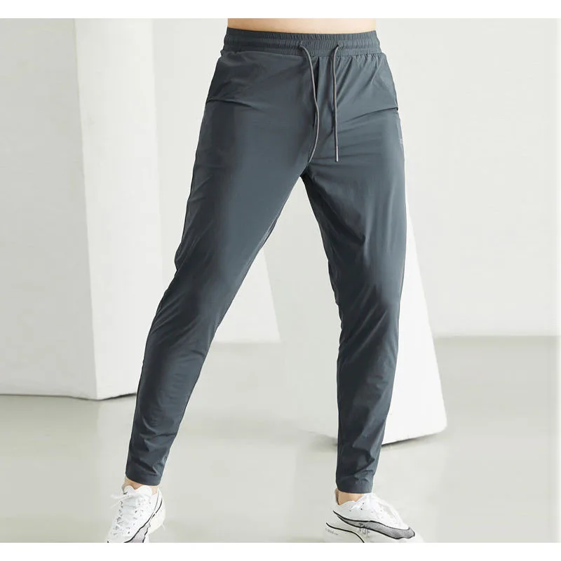 

2025 Men Sportswear Jogging Pants Elastic Running Sweatpants Gym Fitness Tight Trousers Quick Dry Tracksuit Training Sport Pants