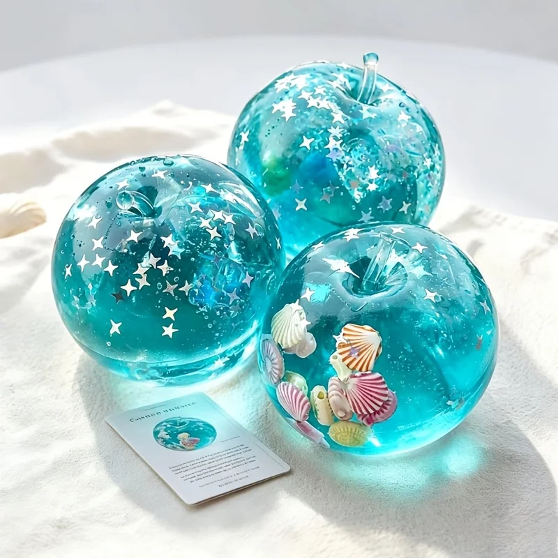 Shunfei Transparent Blue Deformable Soft Toy with Star Sequins and Shell Decorations. This cute stress-relief squeeze toy is suitable for both kids and adults, making it a perfect party gift.