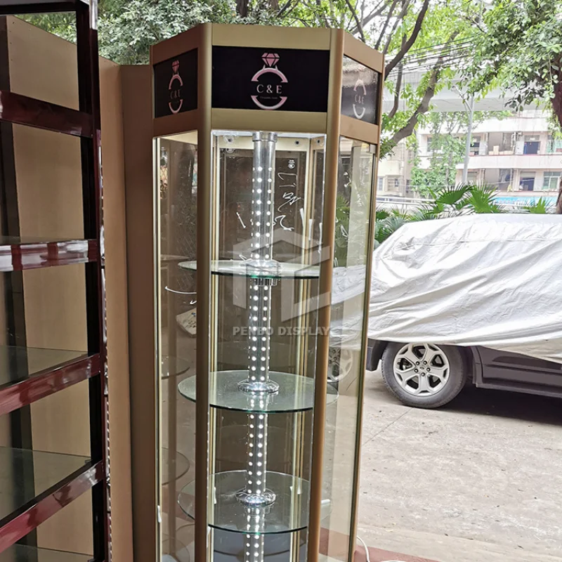 

2025customized. new arrivals metal glass jewelry display Cabinet light rotating shop stand showcase design