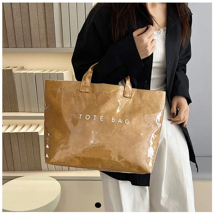 

Large capacity Dupont paper portable transparent PVC shopping bag ladies anti-fruit jelly bag commuting holiday travel bag