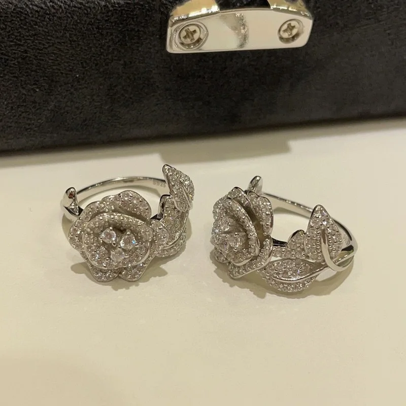 Xiaoyan S925 silver micro inlaid new camellia ring fashionable and versatile temperament anniversary commemorative gift