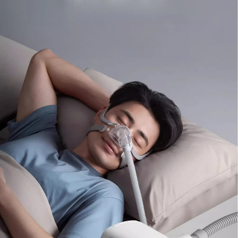 

Household non-invasive elderly sleep apnea syndrome dual-level automatic snoring and anti-snoring device