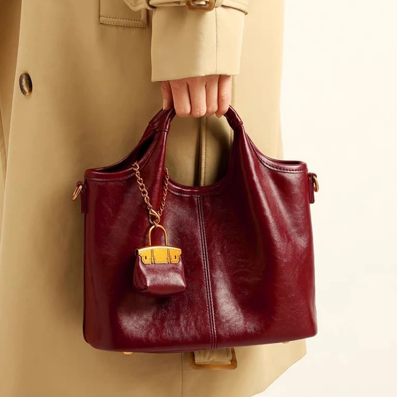 

2025 New Red Glossy Soft Leather Underarm Shoulder Bag for Women Spacious Commuter Wedding Tote Bags Elegant Luxury Handbag