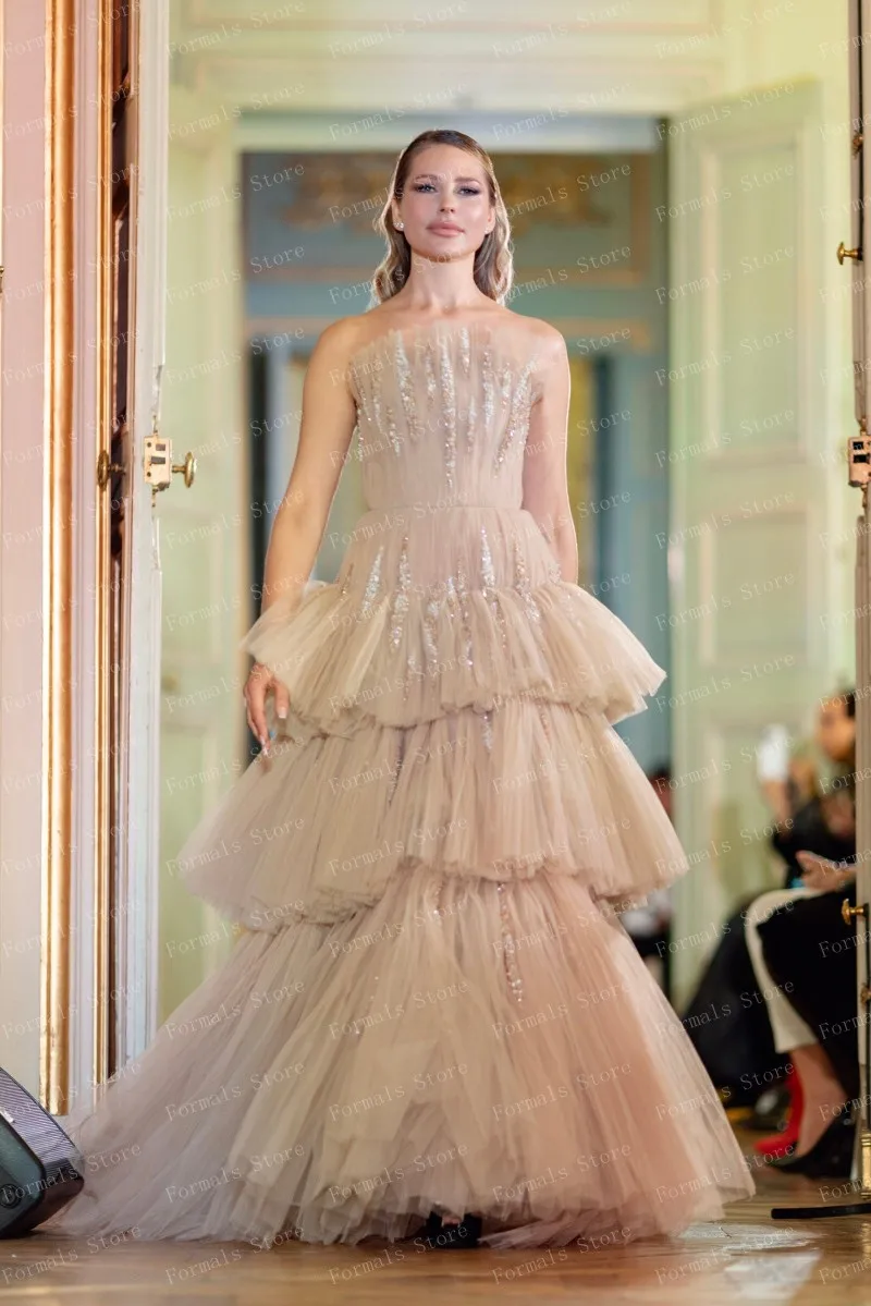 Chic Beige Tiered Gown With Gold Sequins Shining Brightly On Each Layer Flowing Fabric Creates Graceful Movement Perfect For