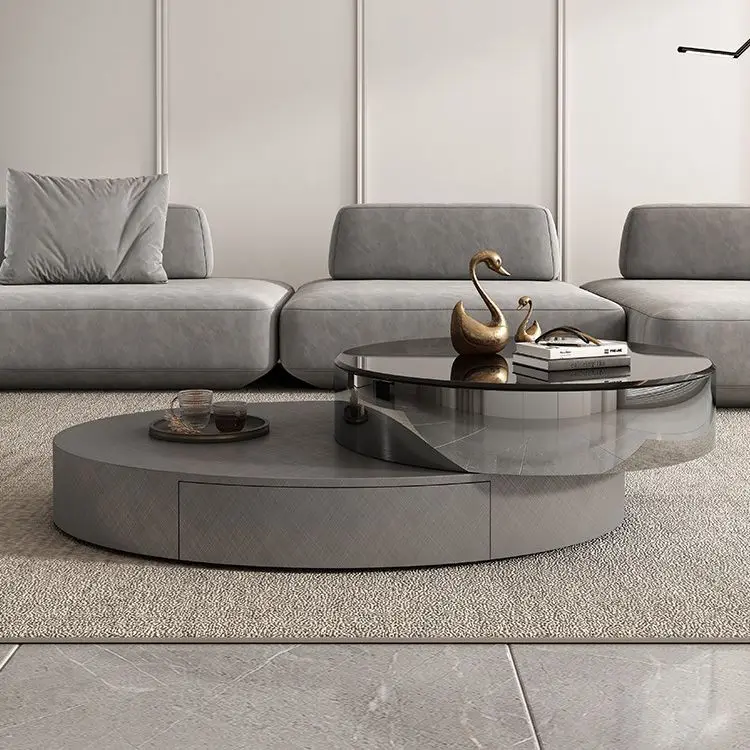 

Italian oval stainless steel rotating coffee table modern simple designer light luxury glass coffee table TV cabinet combination