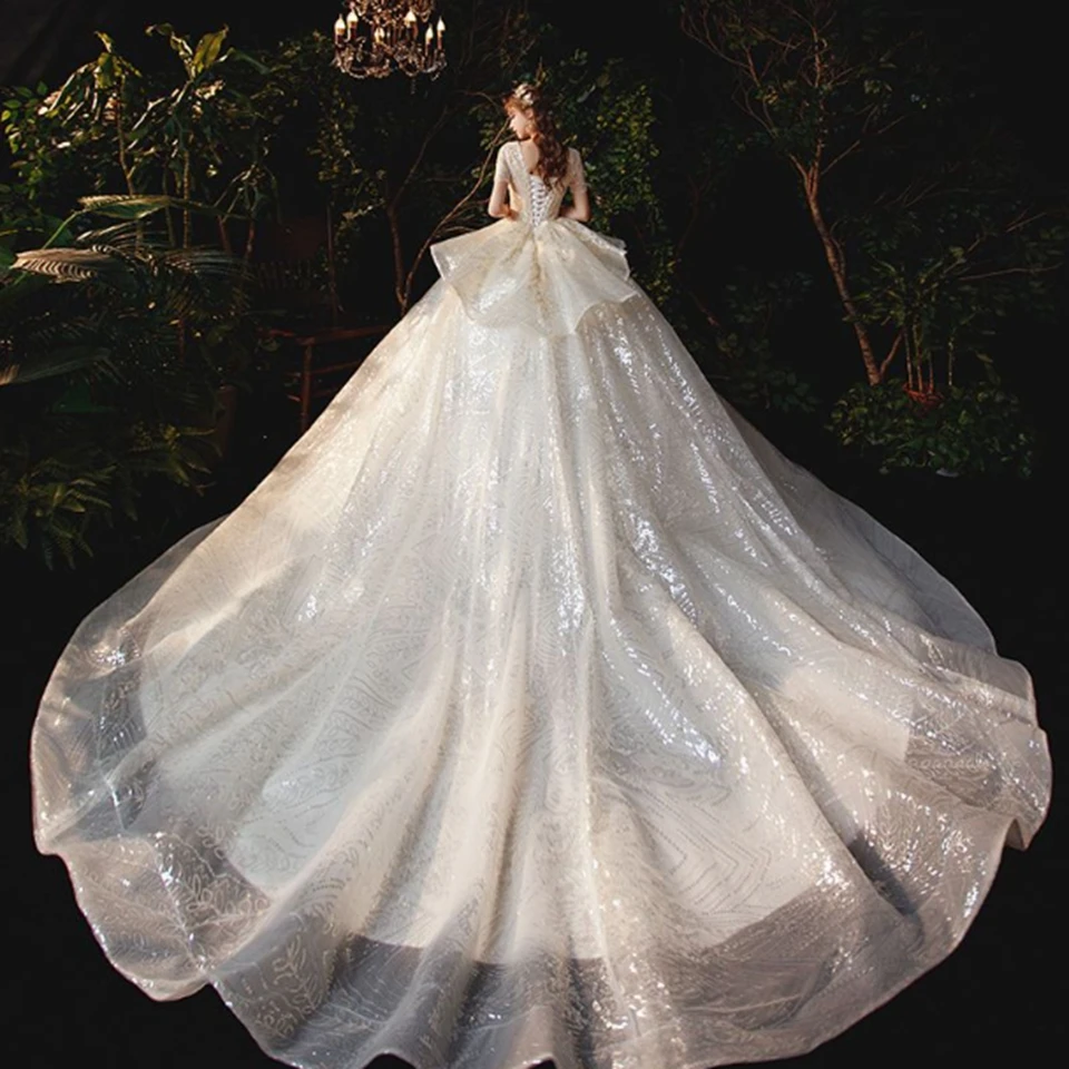 Luxe Lvory/blanc encolure dégagée manches courtes à lacets robes de mariée 2025 longueur de plancher balayage Train Organza paillettes robe de mariée