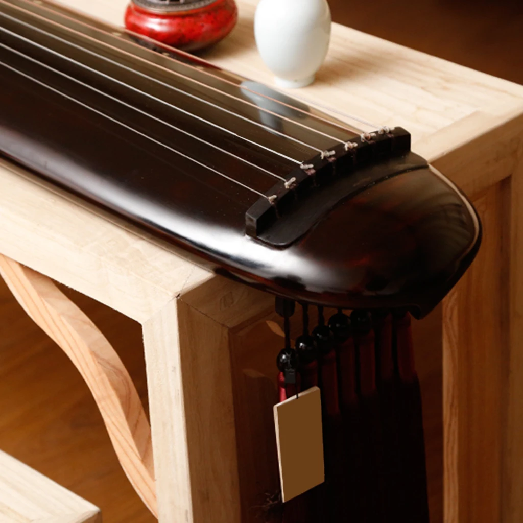 

LOOK Old Paulownia Guqin 7-Stringed Zither Hun Dun Style Ancient String Instrument Sleek And Elegant For Gu Qin Lovers