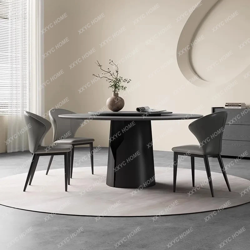 

Современный, простой и элитный минималистичный круглый стол для небольшой квартиры из серой матовой каменной плиты.