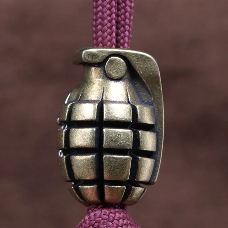 Dual สี Skull Grenade ทองเหลืองมีดลูกปัด EDC DIY Paracord สร้อยข้อมือเชือกเส้นเล็กจี้อุปกรณ์เสริมเครื่องมือกลางแจ้ง Hangings