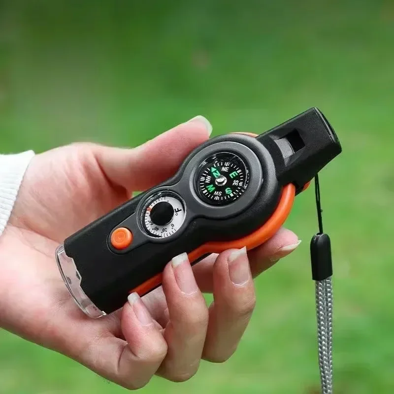 7 in1 Outdoor Survival Whistle เครื่องมือฉุกเฉิน Camping Hiking Rescue ฉุกเฉิน Loud Whistle เข็มทิศเครื่องวัดอุณหภูมิแว่นขยาย