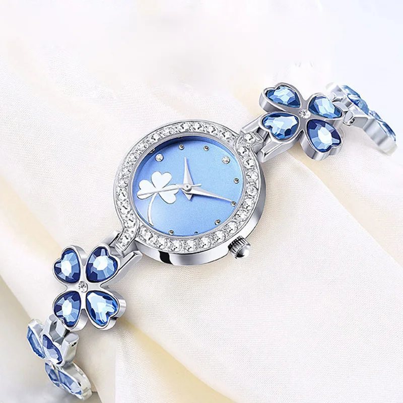 Four‑Leaf Clover Women Quartz Watch Blue Crystal Dial Silver Bracelet Bling Ladies Dress Wristwatch
