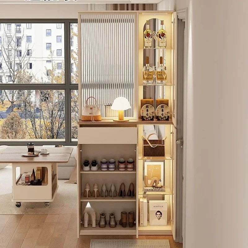 

cream wind is facing shoe cabinet at entrance door, screen partition is integrated into the living room