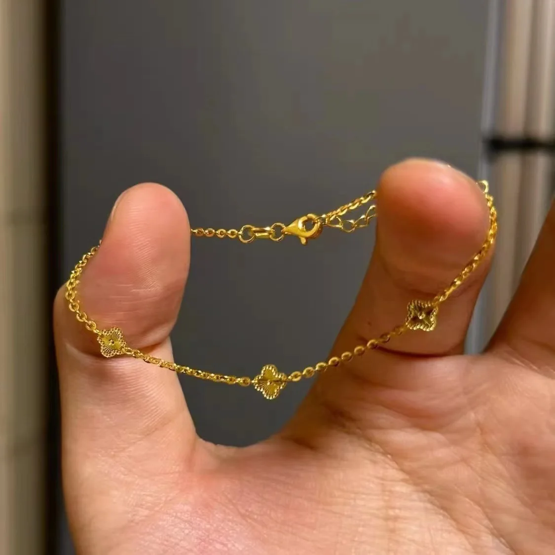 Light luxury 24K real gold four-leaf clover three-flower bracelet exquisite small women's light luxury au999 pure gold  jewelry