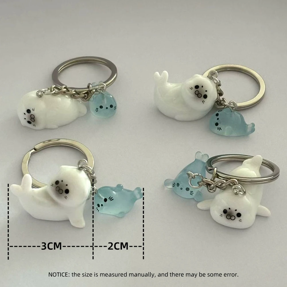 لطيف الأبيض ثلاثية الأبعاد مضيئة أسد البحر المفاتيح مفتاح للنساء تصميم بسيط الحيوان كيرينغ الفتيات الصغيرات حقيبة قلادة مفتاح مجوهرات N949